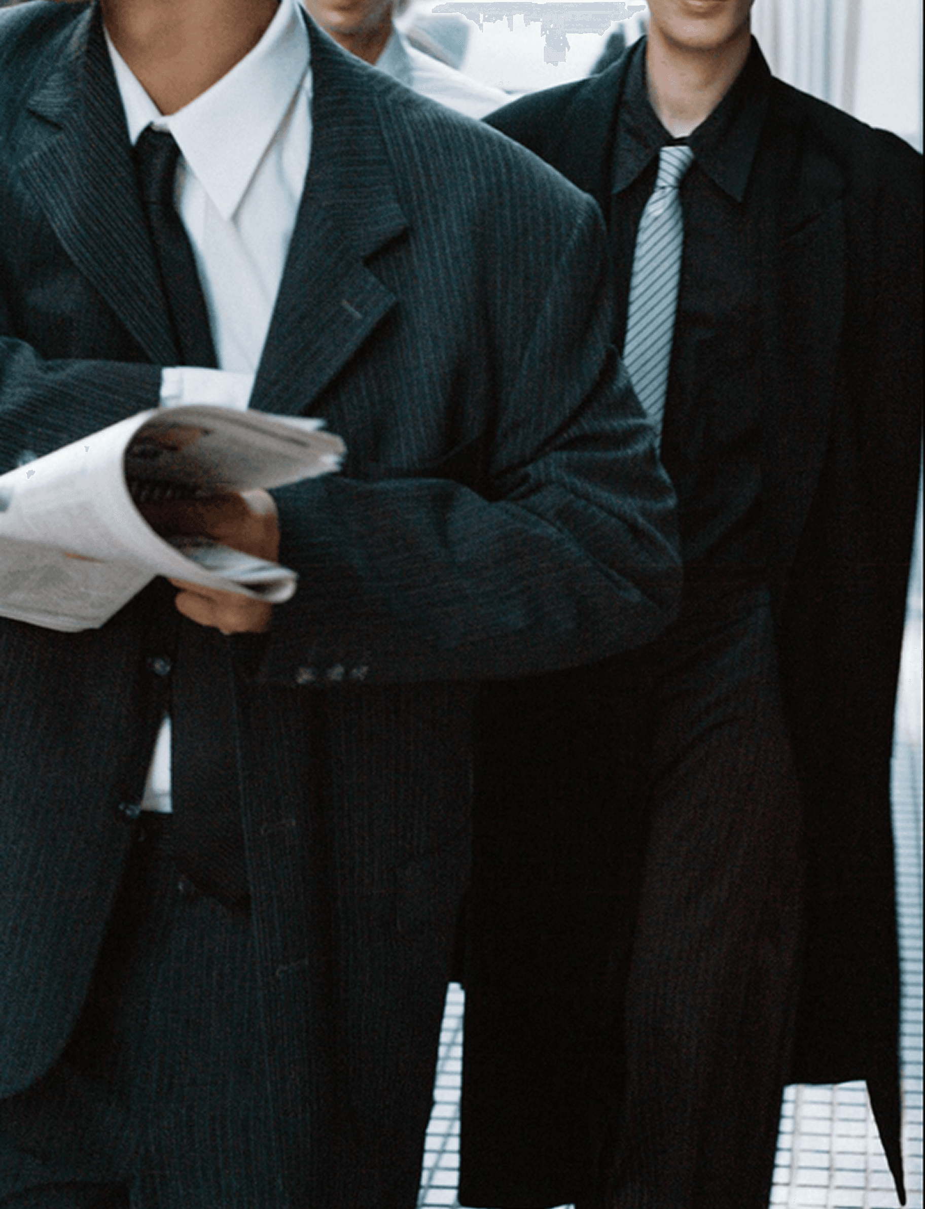 Business people reading a newspaper